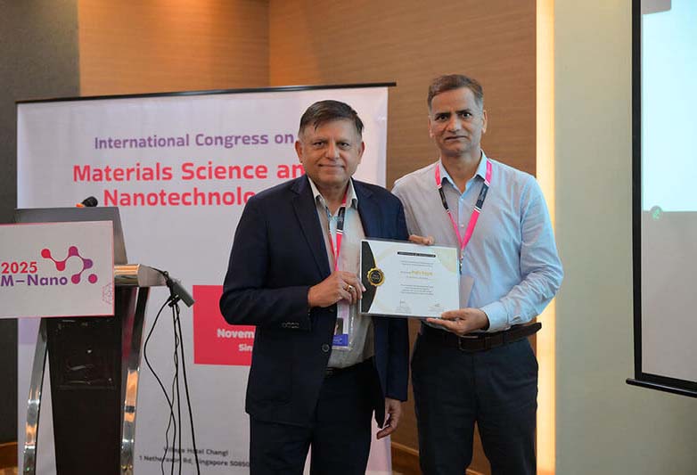 Researcher presenting poster at exhibition hall